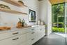 Mudroom/Laundry Room with extensive storage and additional preparation area