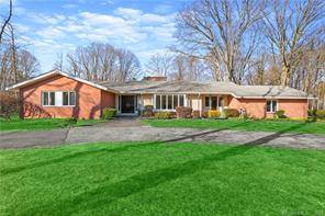 FIRST TIME ON THE MARKET Set on a level one acre lot with a pool and pool house is a mid century modern style home custom built by the well ...