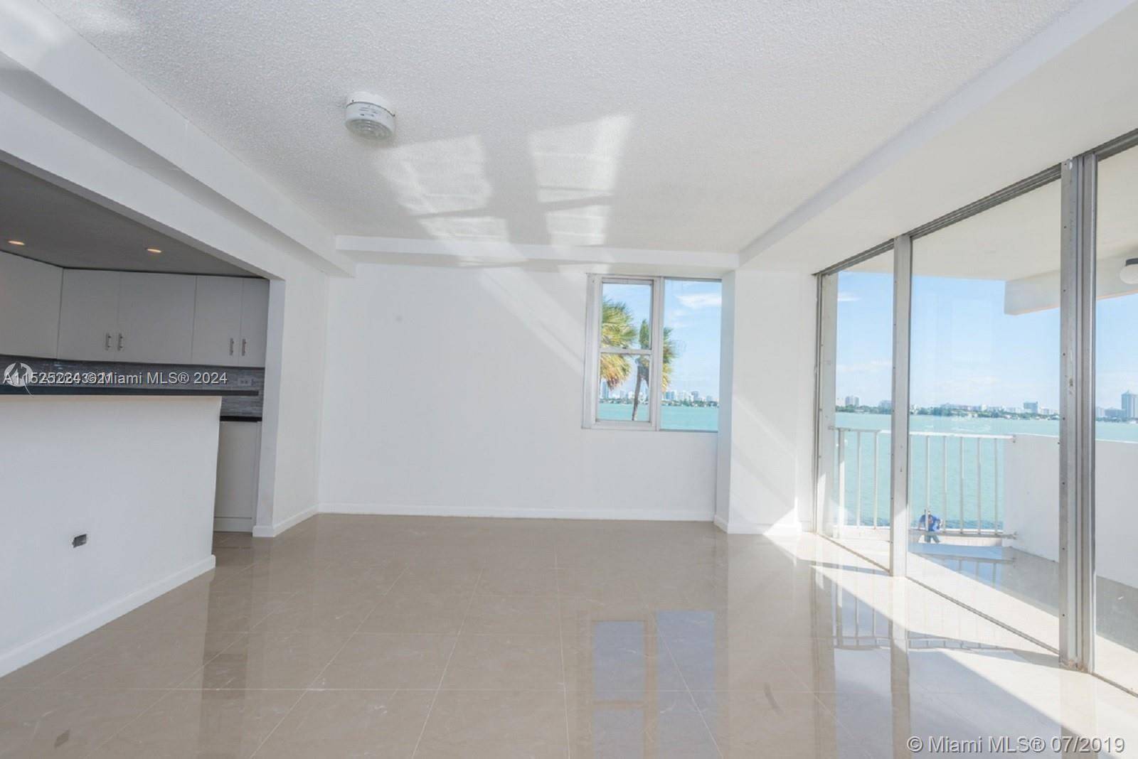 PROMO ONLY TWO MONTHS TO MOVE IN WONDERFULLY REMODELED CORNER UNIT APARTMENT WITH BEAUTIFUL VIEWS TO THE MIAMI BAY AND MIAMI BEACH !