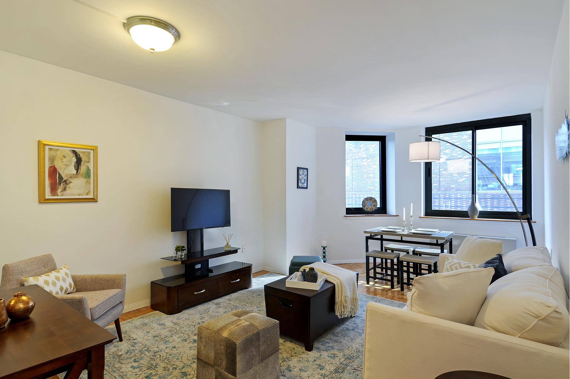 Sun drenched Massive One Bedroom Condo includes a living room large enough for a dining area, a high end kitchen renovation with granite counter tops, Sub Zero refrigerator, Bosch dishwasher, ...