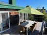 Deck with outdoor dining area and a grill