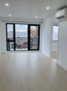 Spare room featuring recessed lighting and an AC wall unit