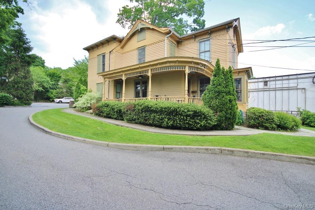 View of front of house with covered porch