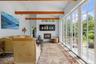 Private sitting room with French doors open to the stone courtyard