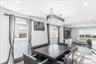 Open-concept living space with dark wood-finish flooring
