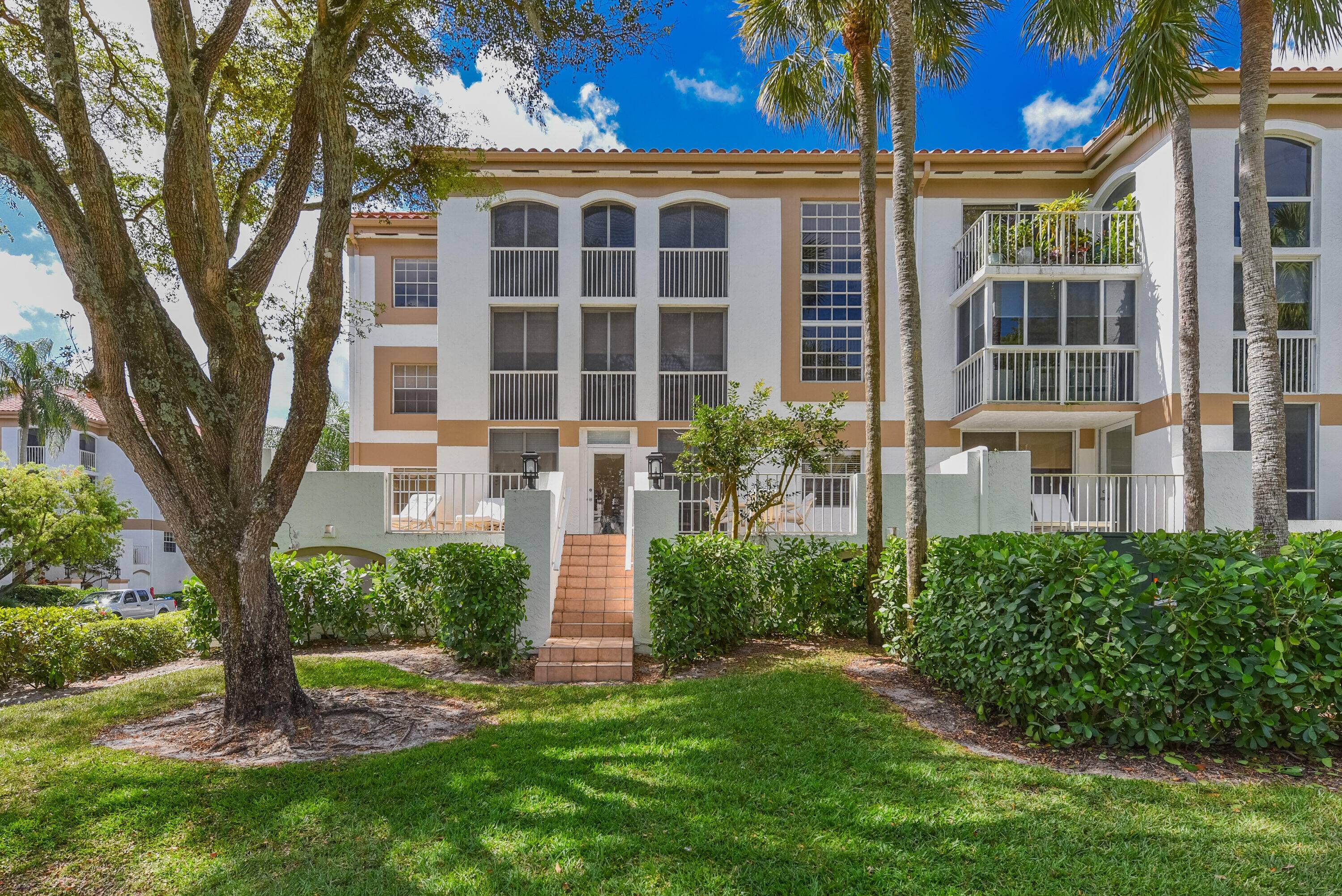 Step into opulent, luxury living at this vibrant three bedroom, two and a half bathroom condo, nestled w in the highly regarded embrace of Boca Grove's exclusive country club.