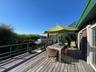 Deck with outdoor dining area and grilling area