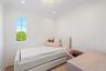 Bedroom with wallpapered walls and ornamental molding