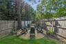 Fenced backyard featuring a patio