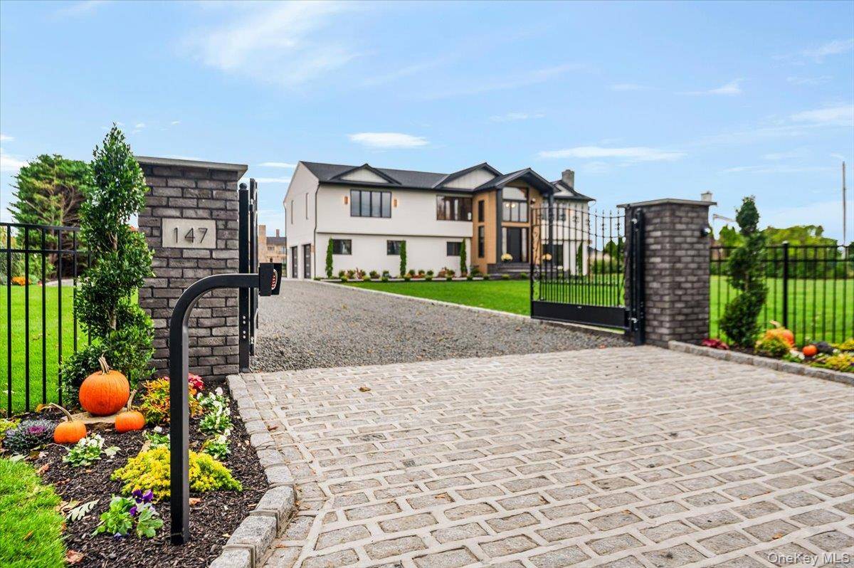 Welcome to 147 W Bayberry Rd a rare waterfront masterpiece.