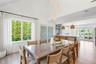 Dining room with light wood-type flooring and baseboards