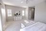 Spacious primary suite with elevated water views and private balcony.