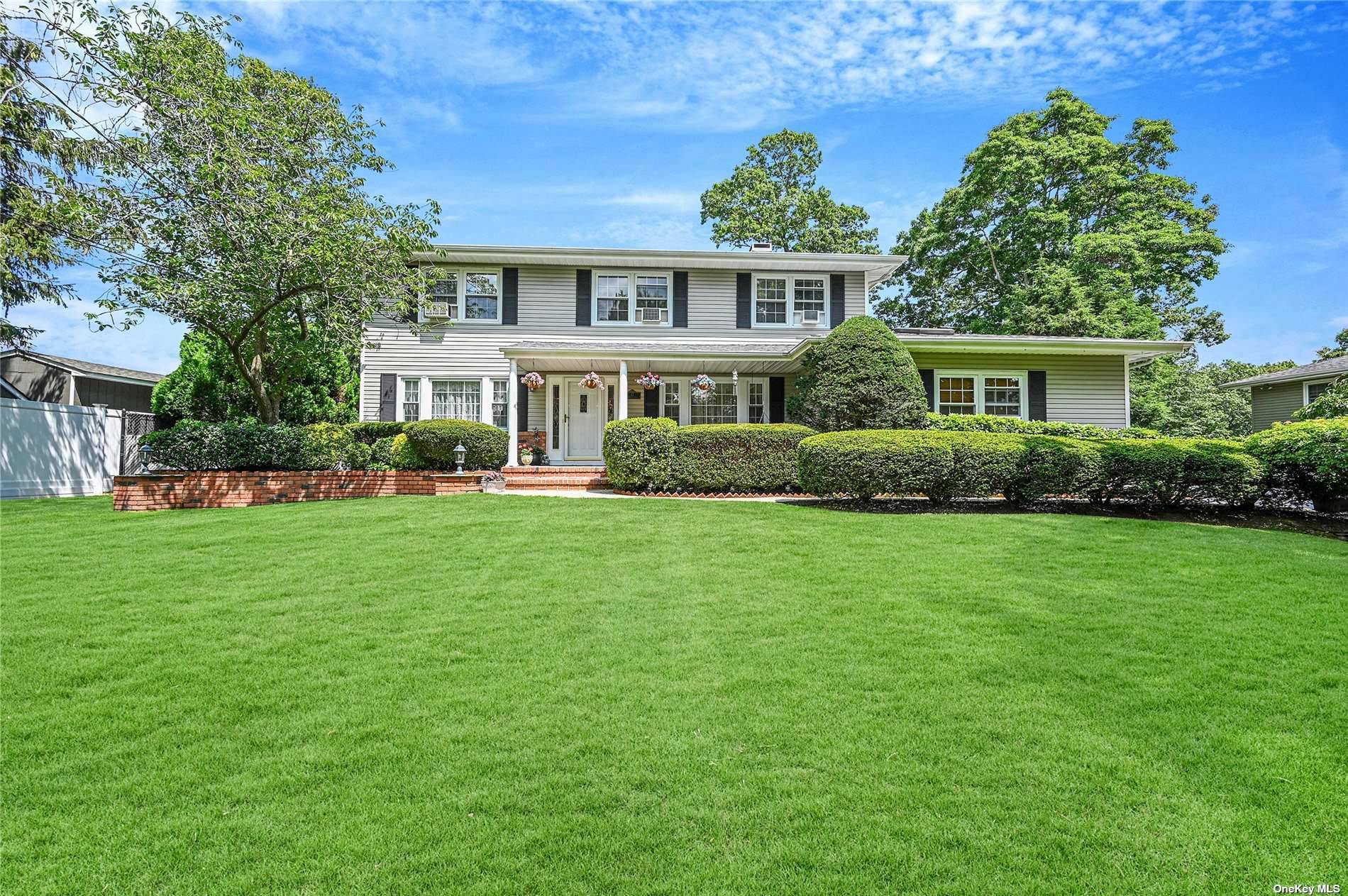 Magnificent central hall colonial located on a private idyllic street located in the much thought after Crestwood Forest neighborhood in the quaint Village of Lake Grove.