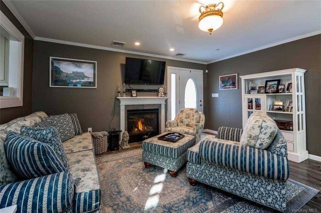 Enchanting amp ; Meticulously Kept Raised Fema Code Home Nestled in the Village of Island Park Oversized Double Lot w 2 Patios amp ; Room for Pool This Residence Has ...