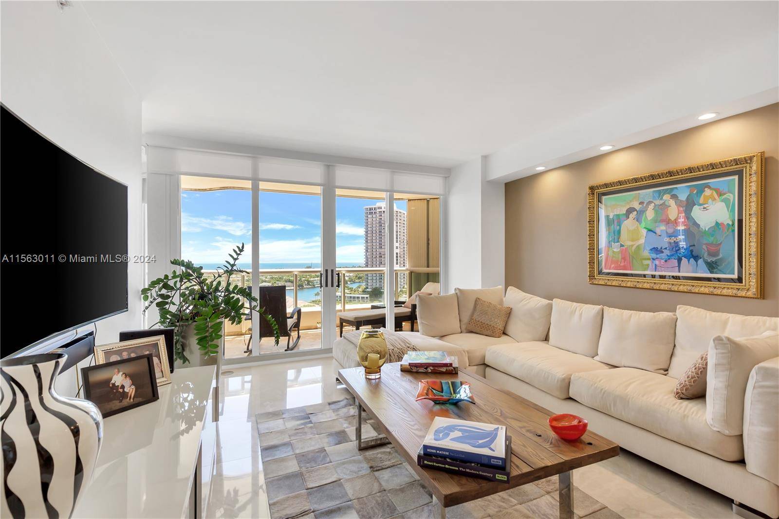 TURN KEY UPDATED 2 BEDROOM DEN UNIT WITH A MAGNIFICENT INTRACOASTAL AND OCEAN VIEWS FROM THE ENTIRE APARTMENT.