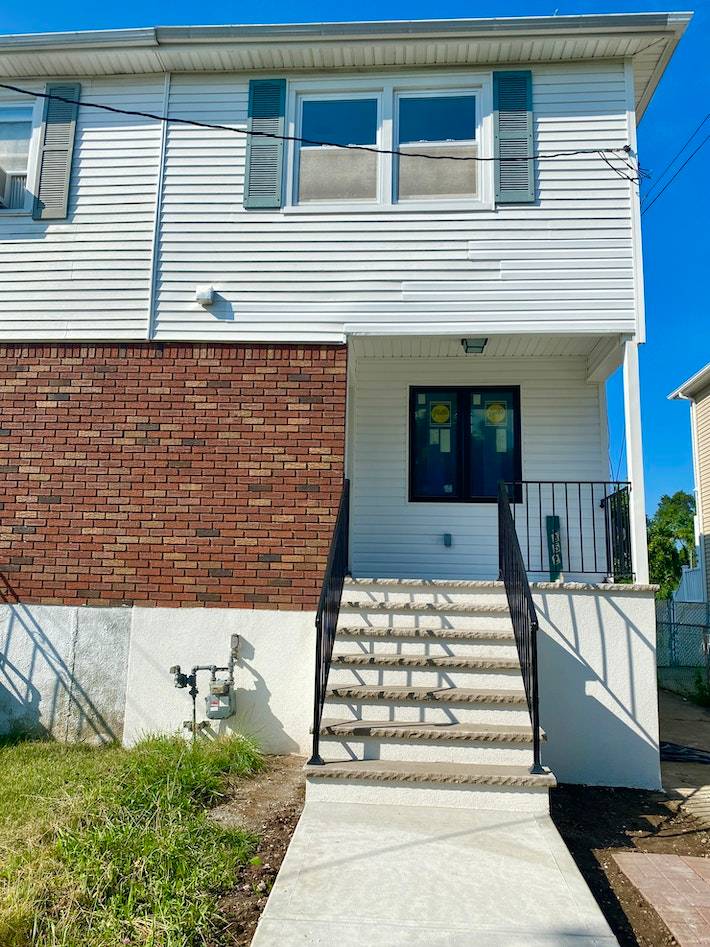 Beautifully updated semi attached one family house at Midland Beach.