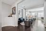 Entryway, sitting area, and kitchen