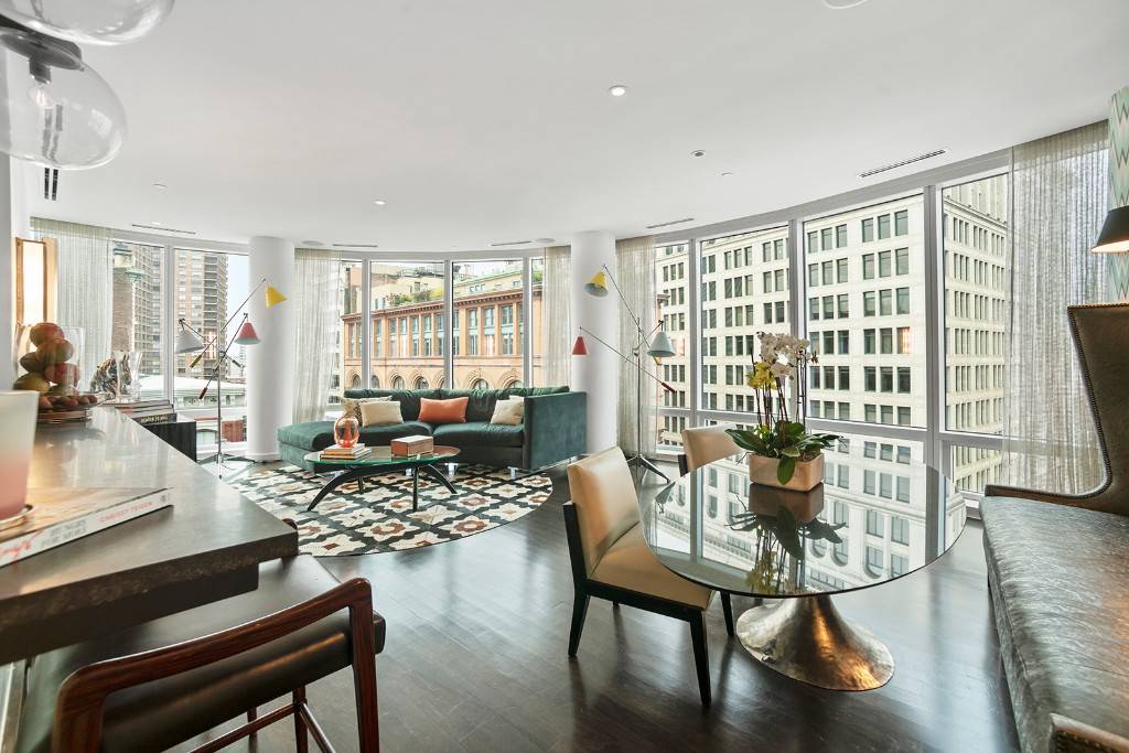 This designer 2 bed, 2 bath apartment in NoHo's most luxurious building features a curved, floor to ceiling wall of windows with spectacular city views and abundant light with a ...