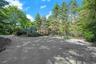 A spacious front guest parking court welcomes visitors with ease and accommodates gatherings large and small.
