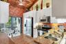 Spacious Kitchen with White Cabinetry, SS Appliances, and Granite Countertops