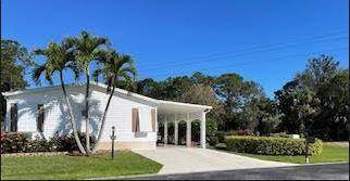 Beautiful and immaculate move in home in Stuart's premier 55 manufactured home community.