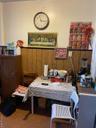 Office area featuring wood walls and a wainscoted wall