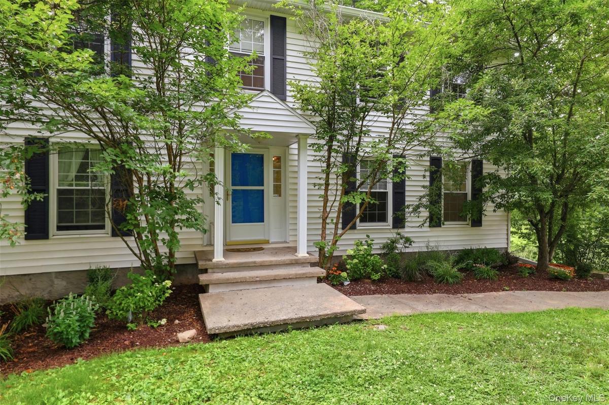 Fun blue door and lovely landscaping ~