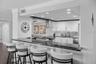 The counter bar provides a cozy space to chat with guests as you prepare the evening's happy hour drinks.