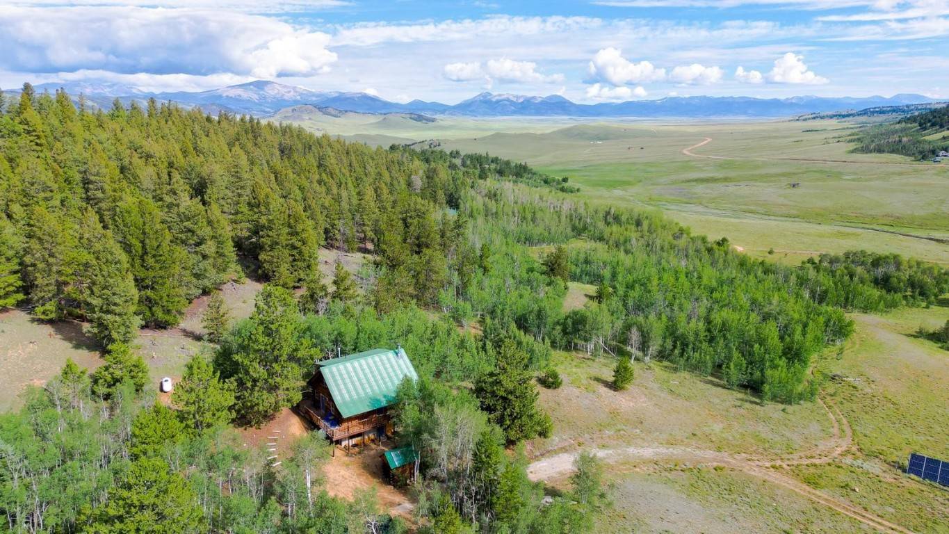 The ultimate Rocky Mtn escape, this completely remodeled off grid log home on 35 private acres is the perfect combination of rustic modern design.
