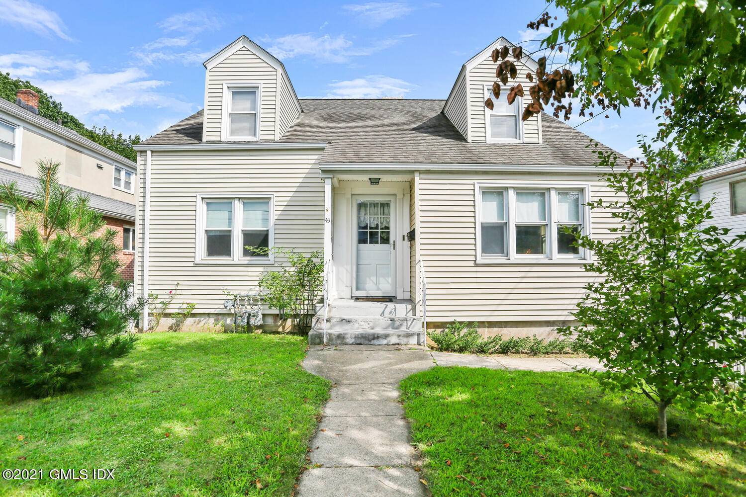 Gracious two family in an established neighborhood convenient to schools, town and train.