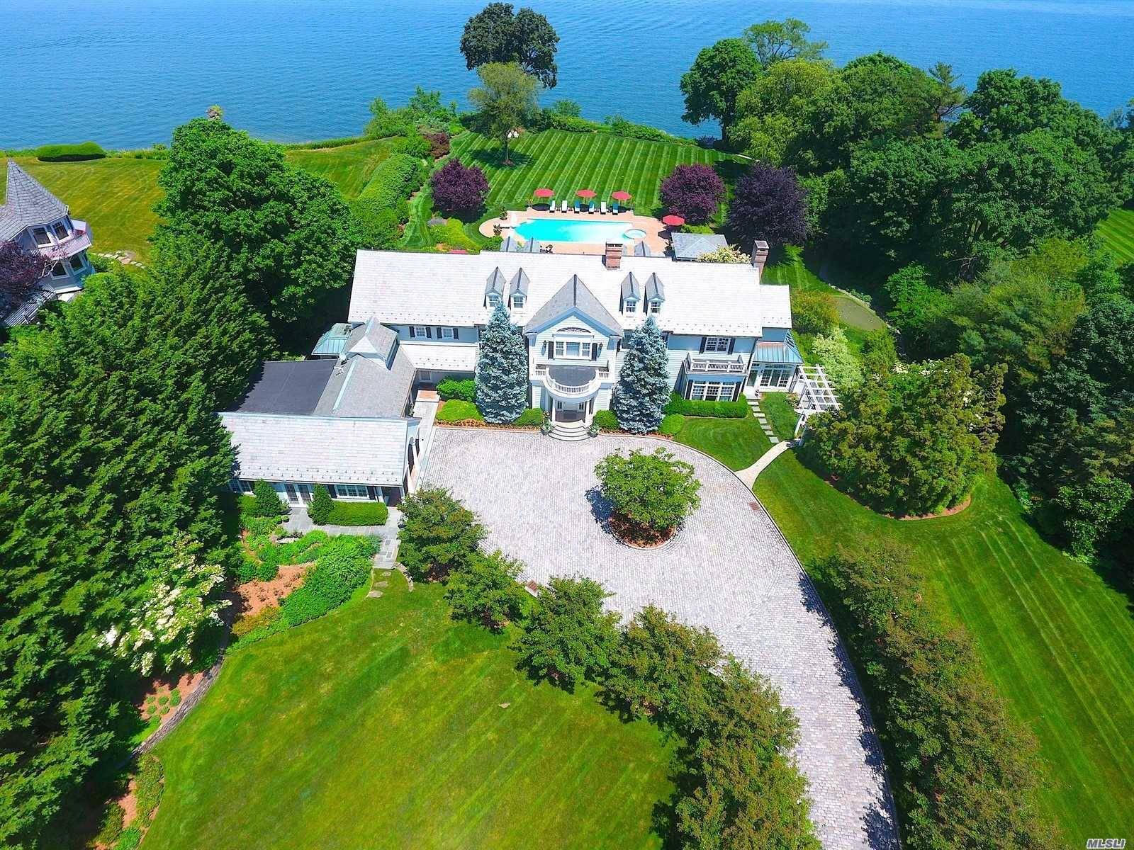 Overlooking Huntington Bay, 6 Wincoma Drive is an exceptional waterfront home on 2.