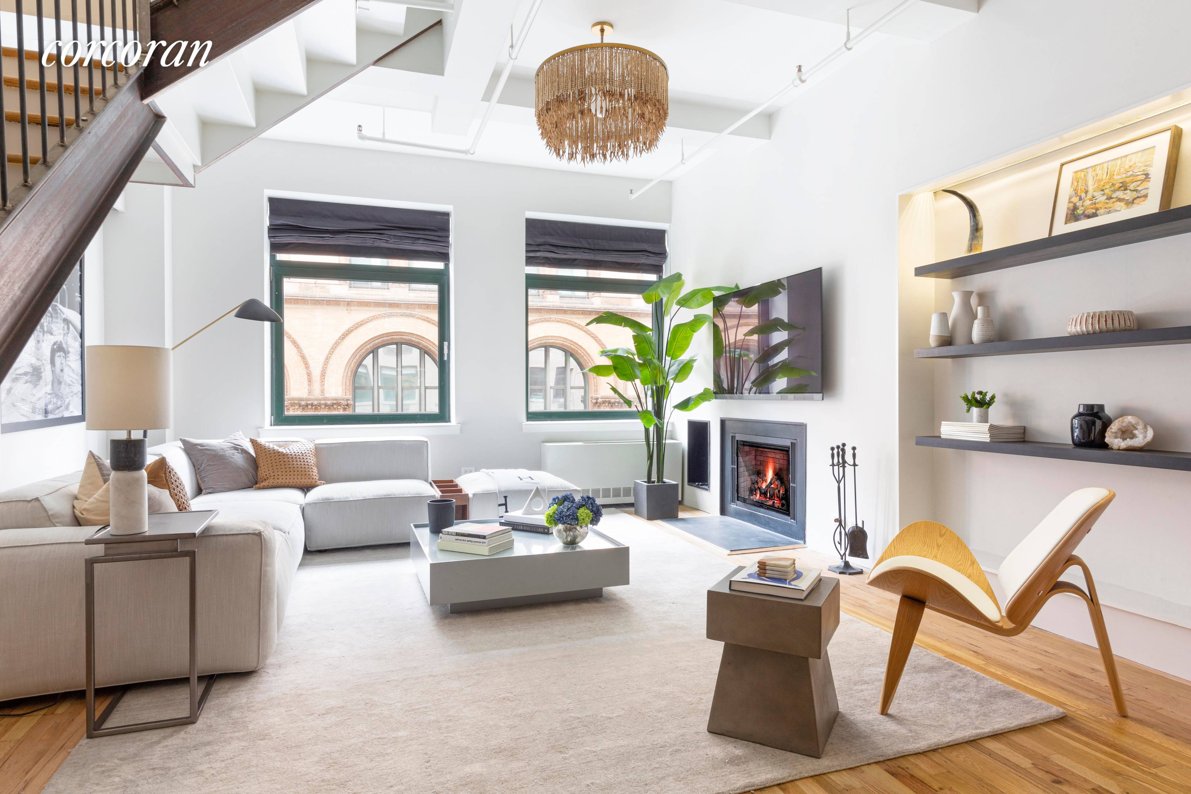 NOHO DUPLEX DESIGNERS LOFTRare opportunity to own an oversized 1, 200 square foot plus, two story loft with a wood burning fireplace in the historic Silk building condominium in NoHo.