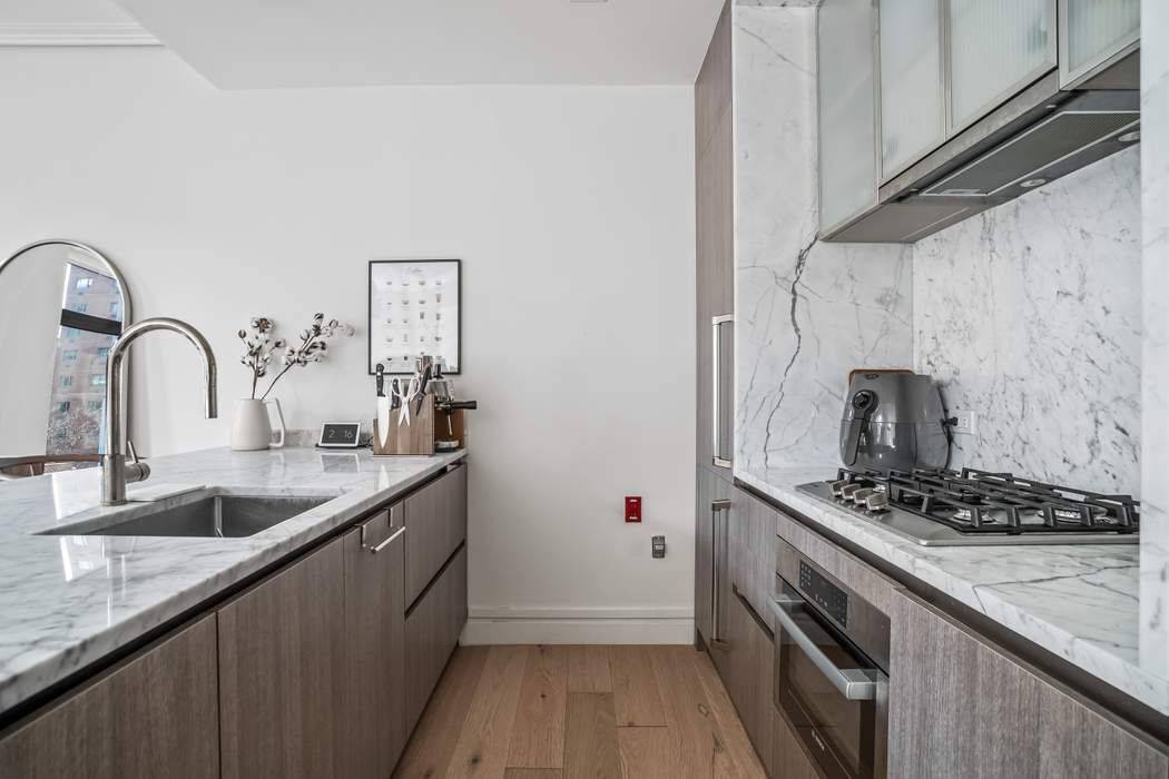 Residence 502 at Hillrose 28 condo, newly completed in 2020, is a charming, modern, south facing one bedroom, one bathroom apartment spanning 627 square feet.