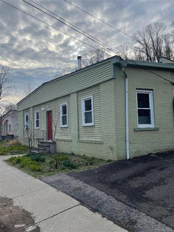 Unique and Rare 3 unit building in the heart of Piermont, NY features one 3 bedroom apartment, one 2 bedroom apartment and a first floor large workshop with a new ...