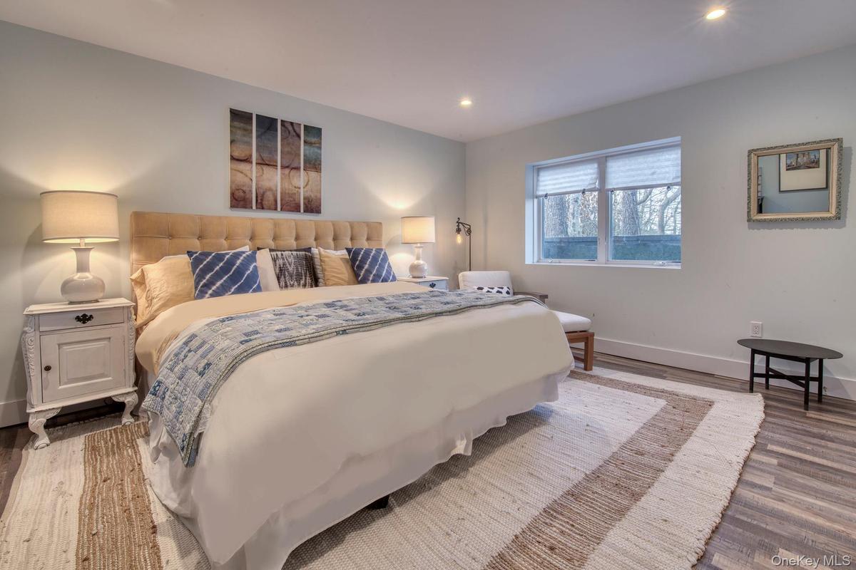 Bedroom with recessed lighting, baseboards, and wood finished floors