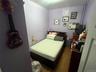 Bedroom with wood finished floors