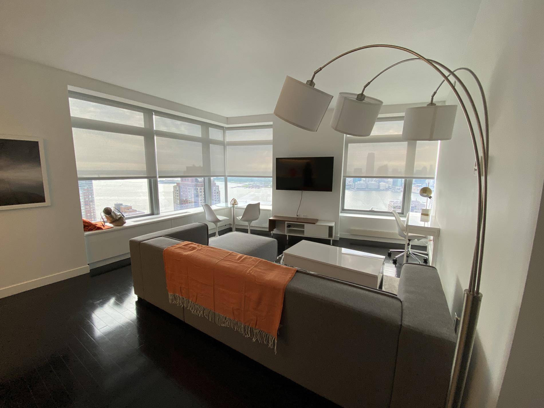 Newly Furniture Glorious Condo residence 41A is a gorgeous corner 1 bedroom home boasting unparalleled views of the Statue of Liberty and the NY city skyline.