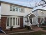 Colonial house with brick siding