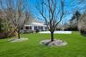 View of yard from the rear of the backyard featuring a patio area and pergola