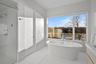 Bathroom with vanity and a tub