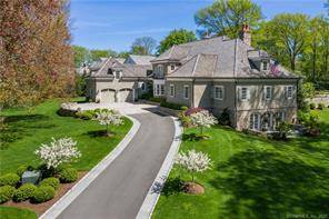 This very special shingle and stone colonial was custom built in 2014 and is situated on 1.