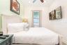 Spacious bedroom with clean coastal design in Kissimmee short term rental approved property
