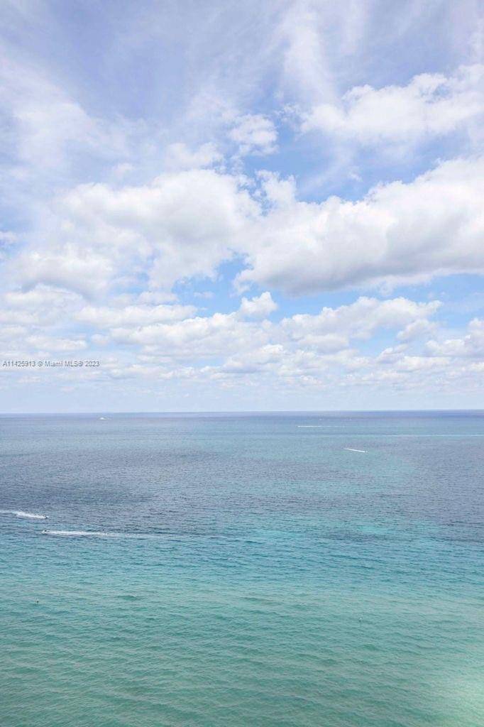 A luxury corner unit with direct access to Sunny Isles pristine beaches, spectacular ocean and city views.