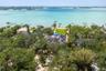 Private, gated setting surrounded by lush tropical landscaping.