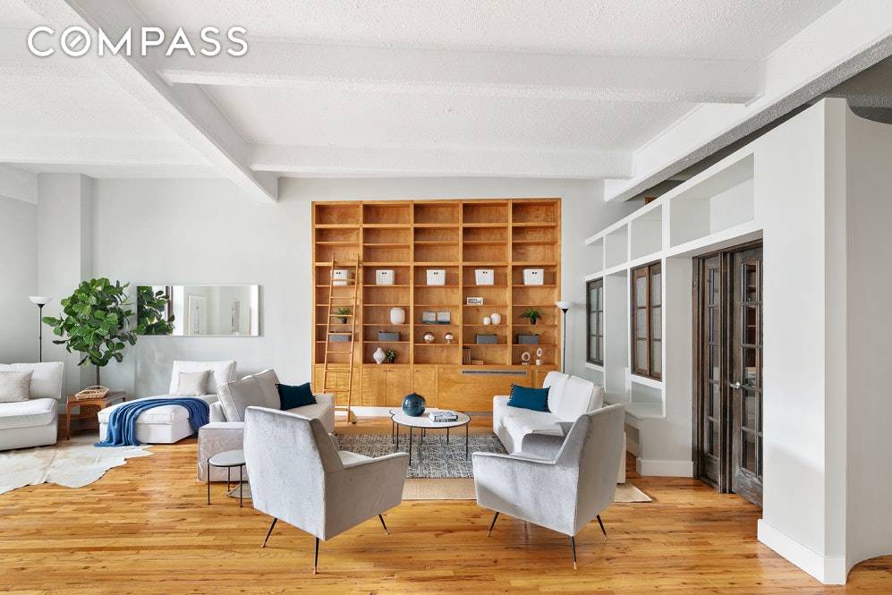 Sophisticated Soho style true loft with expansive proportions, original architectural elements, and jaw dropping view of the Brooklyn Bridge.