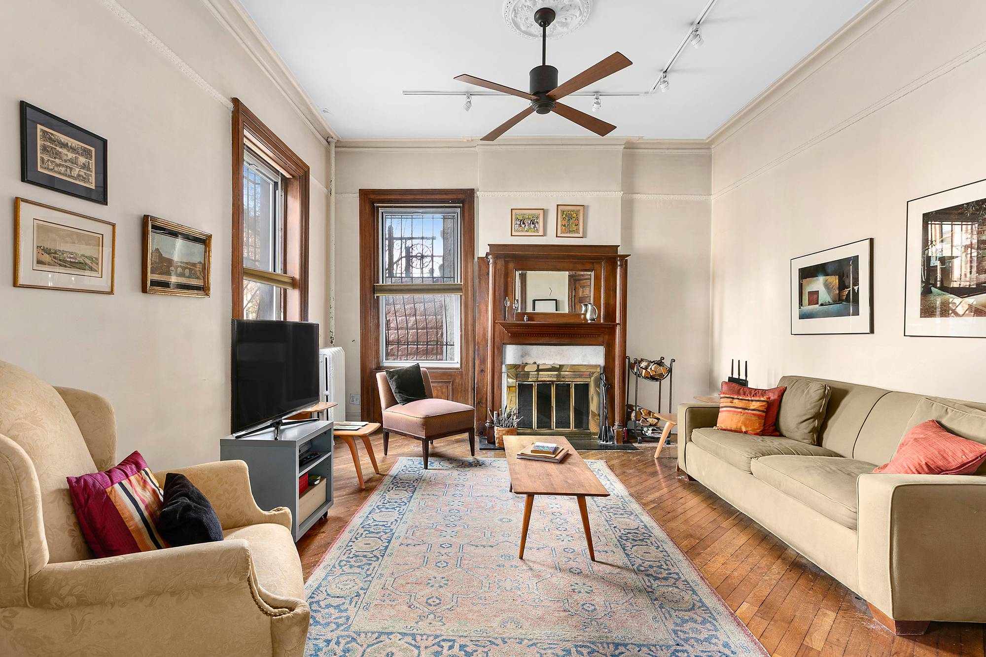 Welcome to this rare and elegant duplex corner apartment featuring large windows in every room, high ceilings, original details of glass pocket doors, hardwood oak floors, and carved wood mouldings ...