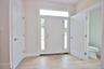 Entryway featuring wood tiled floors and baseboards