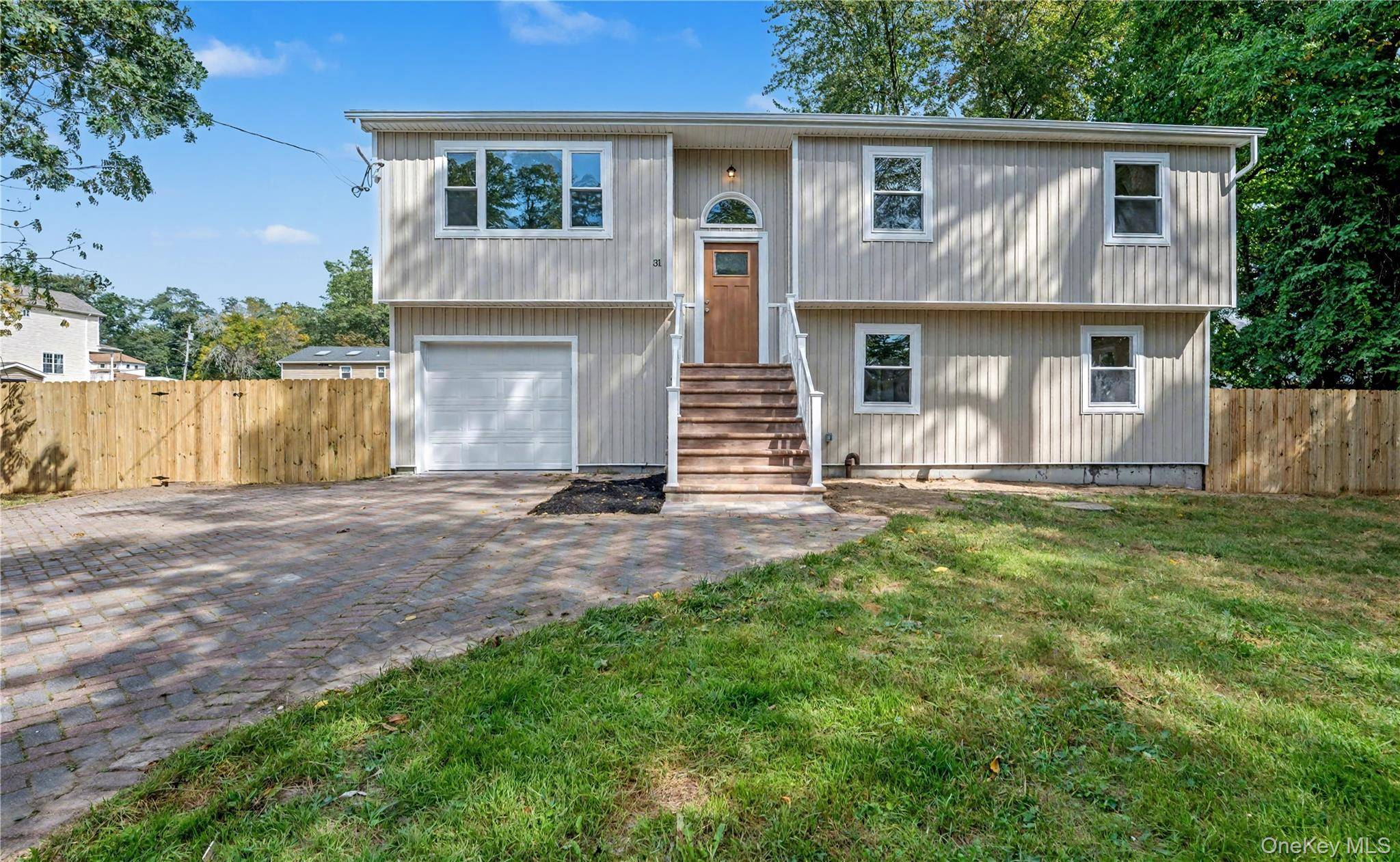 Welcome to this stunning 5 bedroom, 3 bath Hi Ranch, fully renovated from top to bottom.