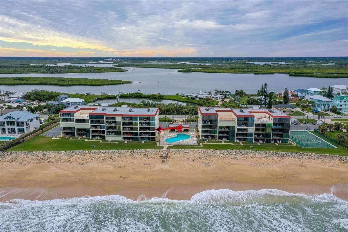 A sweeping ocean-facing view captures the full layout of the development, showcasing both the Atlantic beachfront and lush inland waterways beyond.