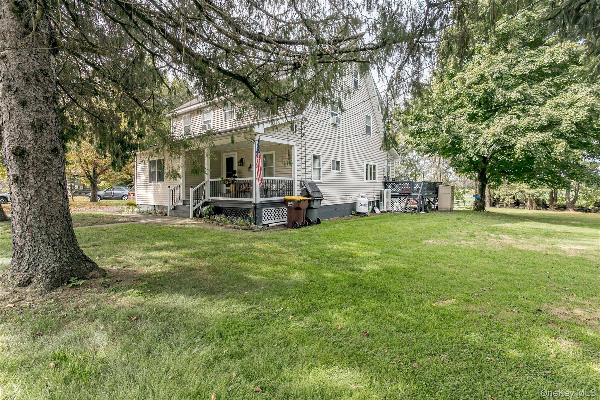 Nestled among the famous Black Dirt Region farms of Pine Island on over an acre of useable property is this cape colonial home with a welcoming front porch.